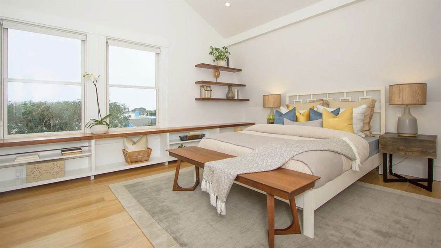 Minimalist bedroom with wooden shelves