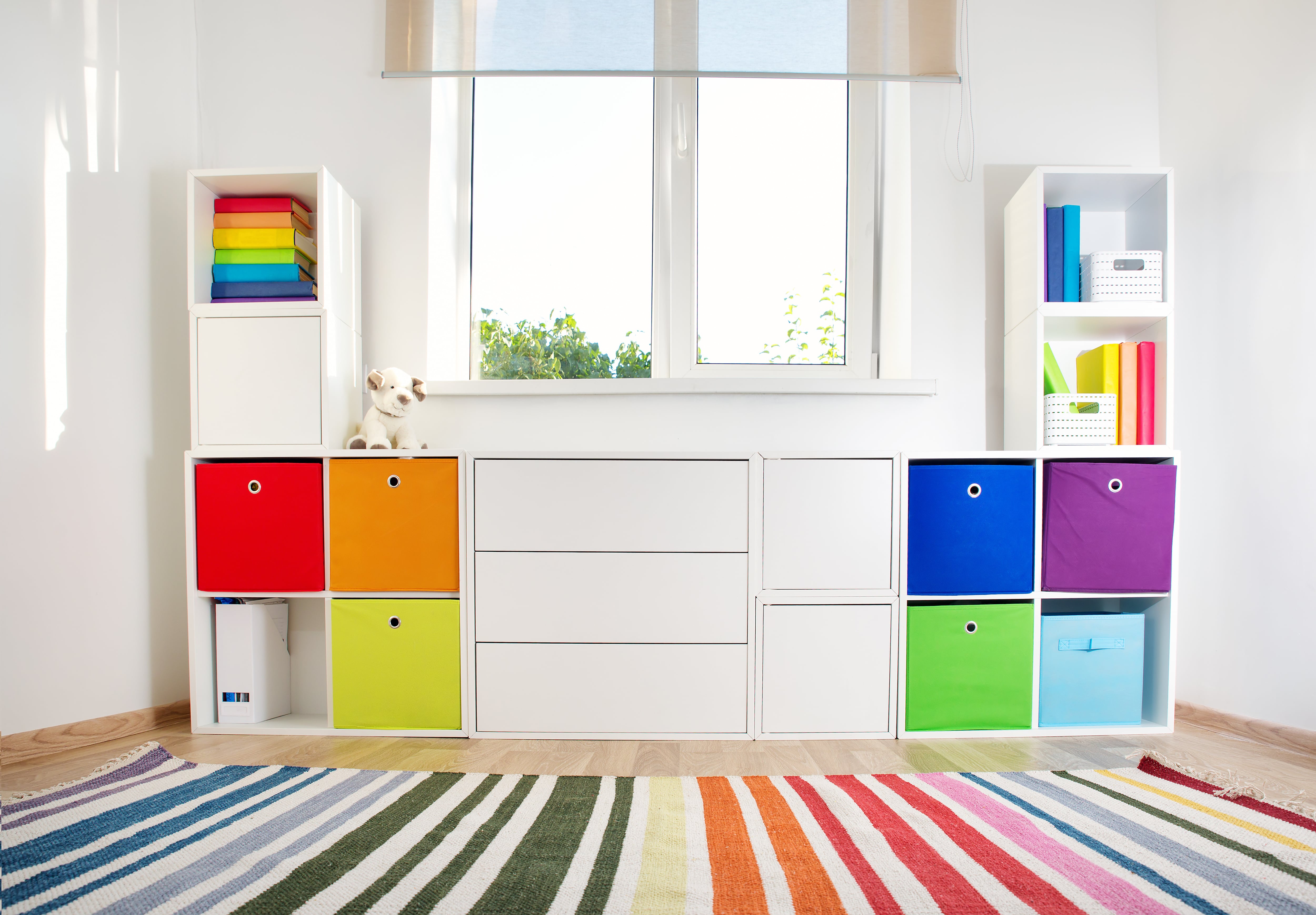 White cube organization cabinets with multi-color baskets