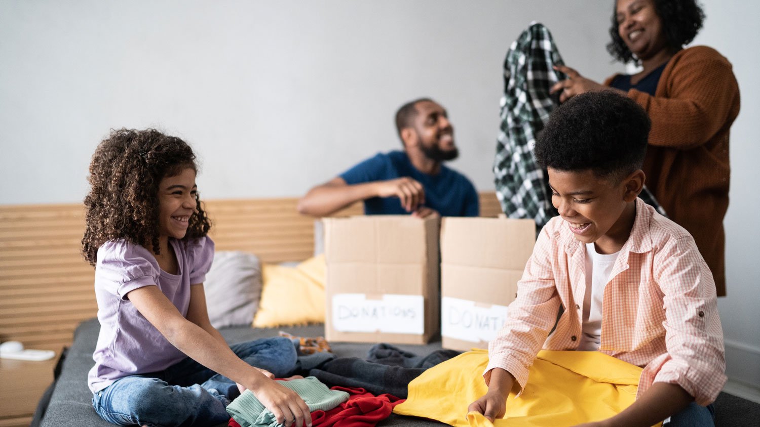 A family of four decluttering a closet