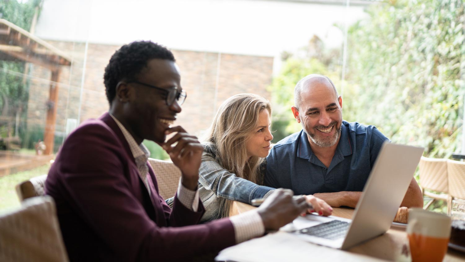 A finance advisor doing a meeting with couple at home