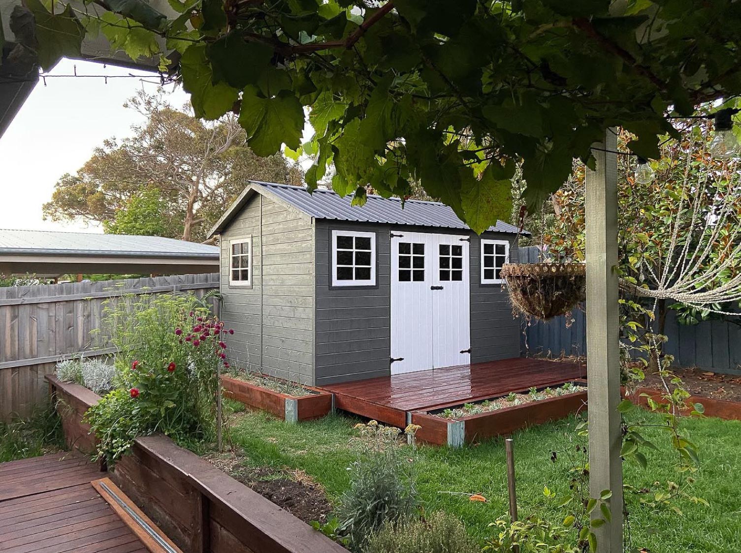 An garden shed with a deck