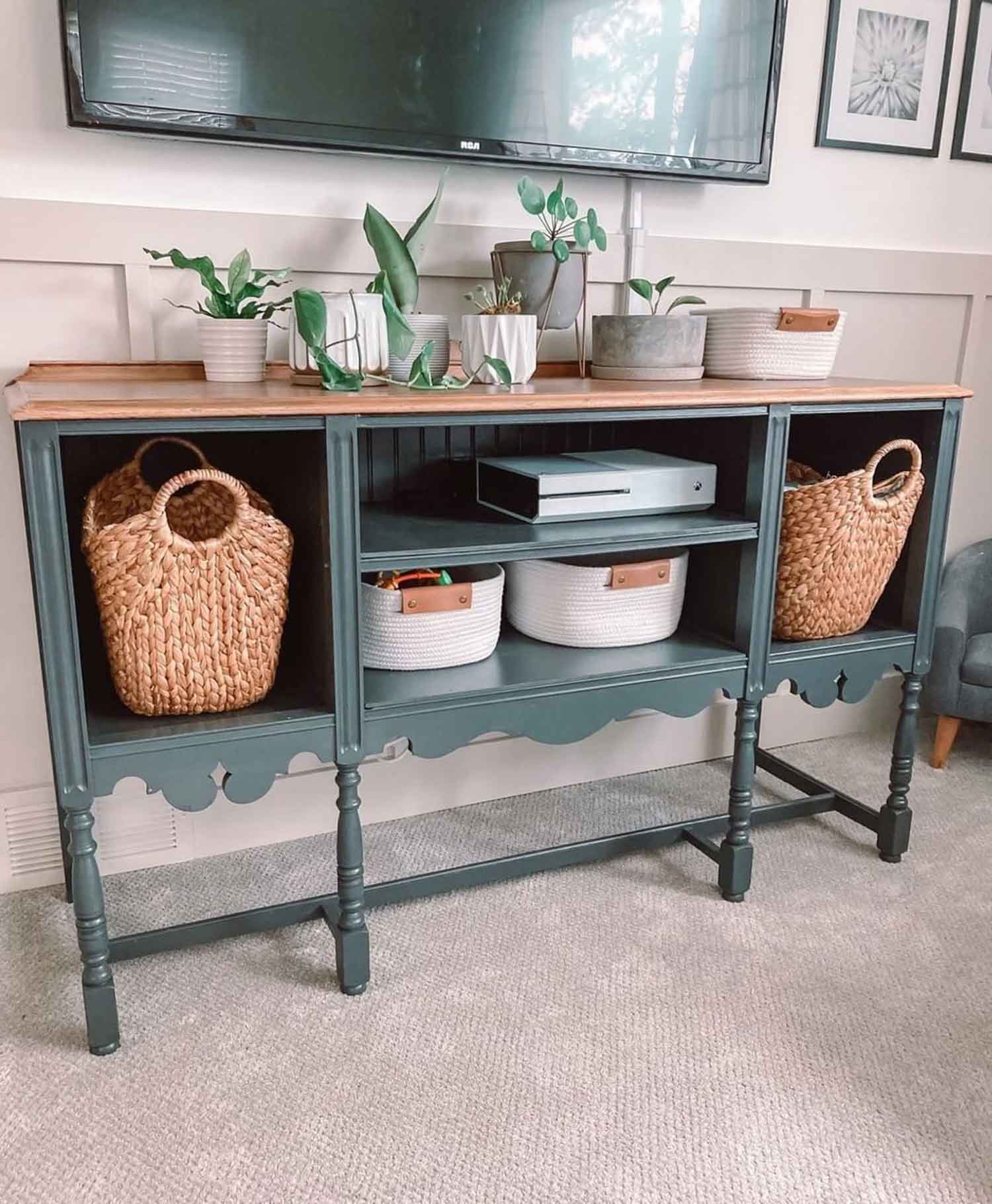 Green tv stand with plants and baskets