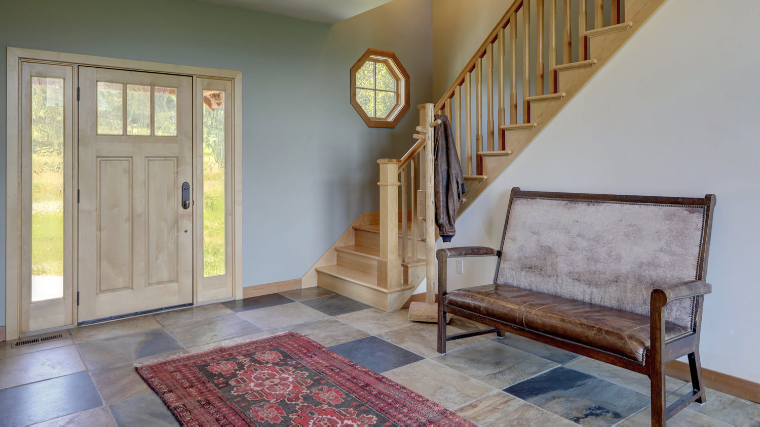 A house’s hallway with natural stone tiles