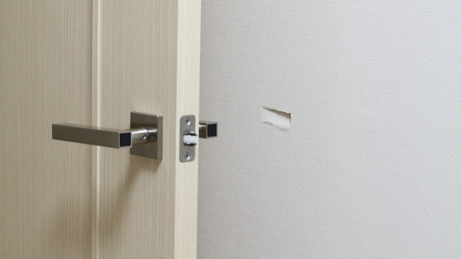 A hole in the drywall caused by a doorknob