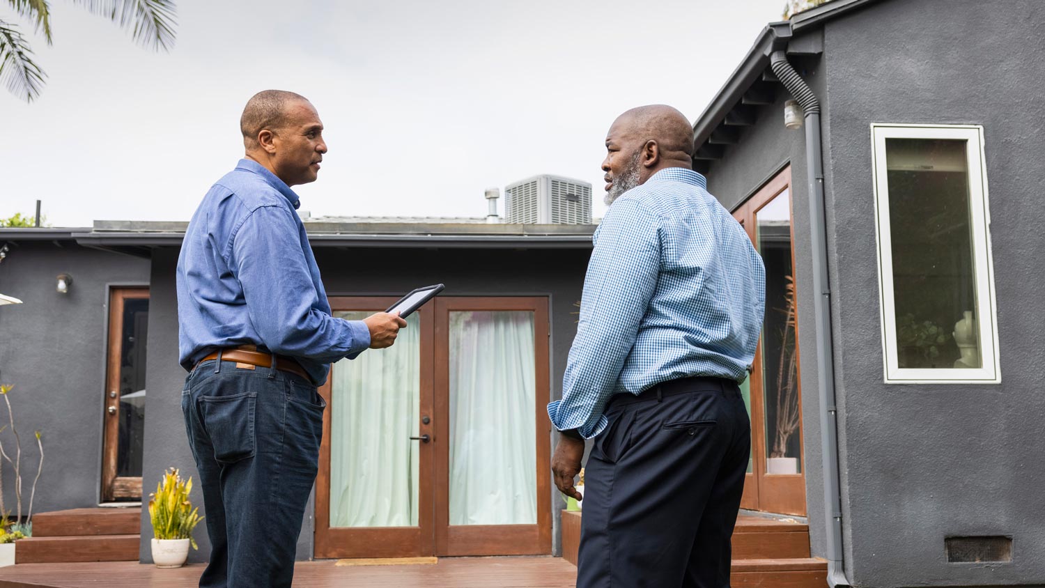 A homeowner talking to a geothermal pro