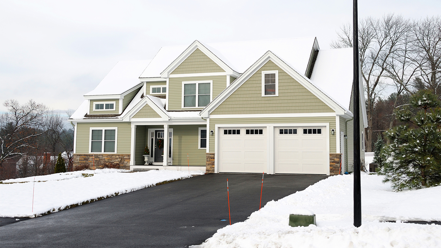 Beige house with clear driveway