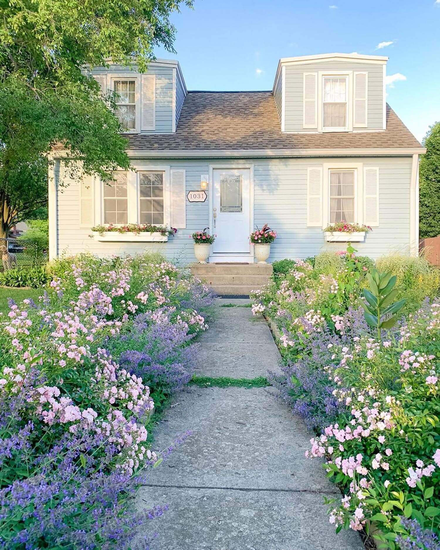 A house’s welcoming walkway filled with flowers