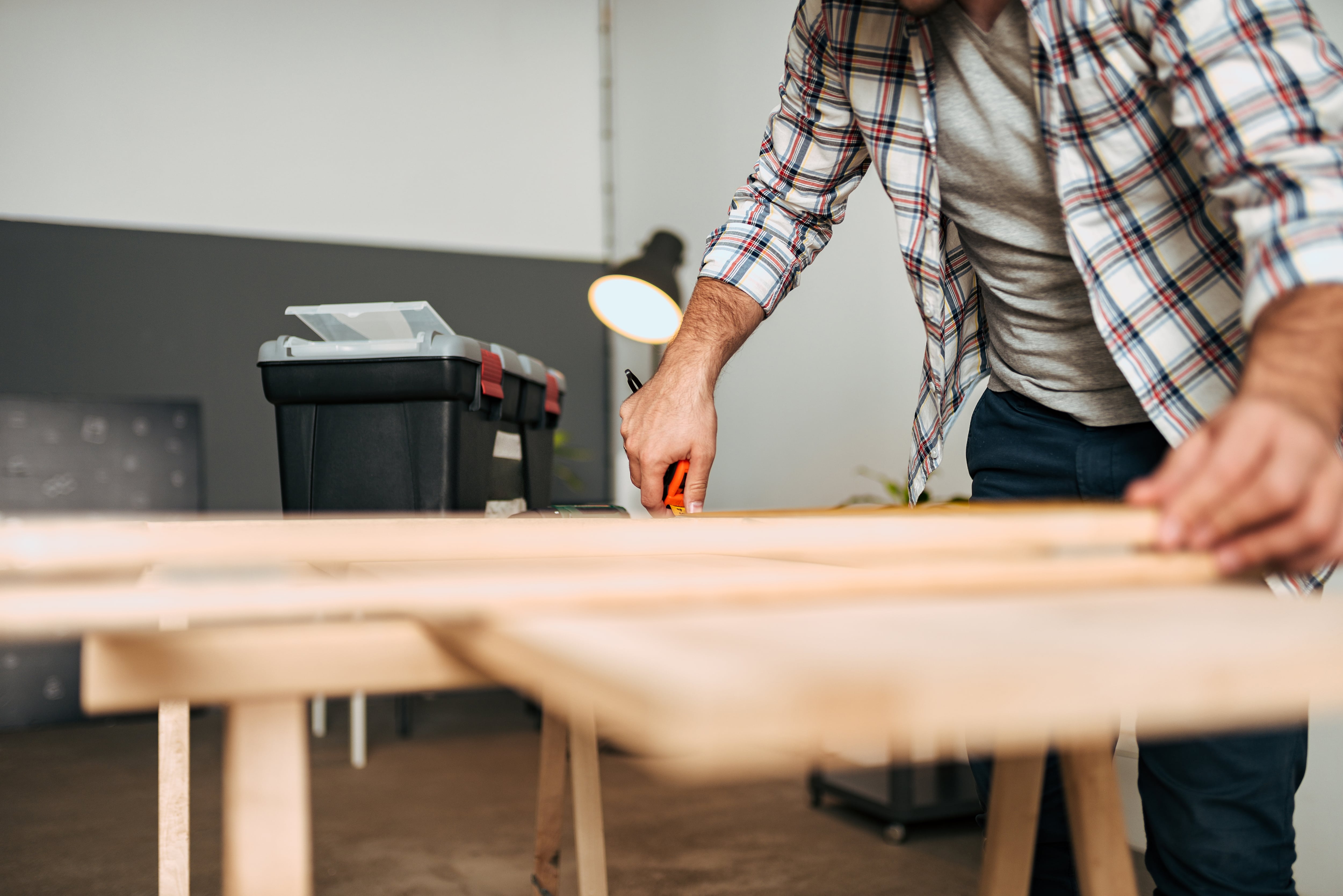 Inspecting cut wooden boards before installation