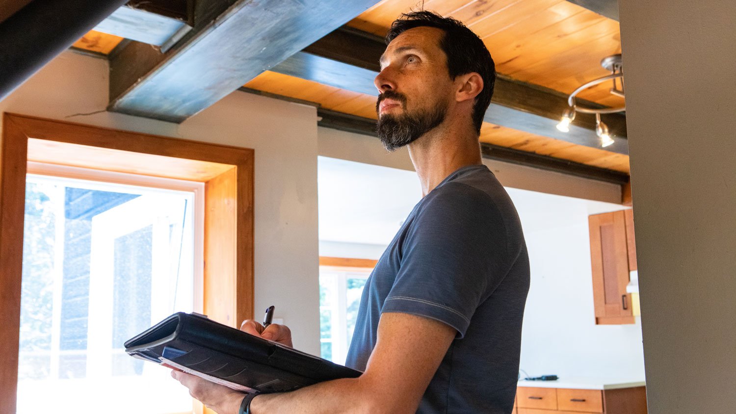 An inspector checking for mold in a house