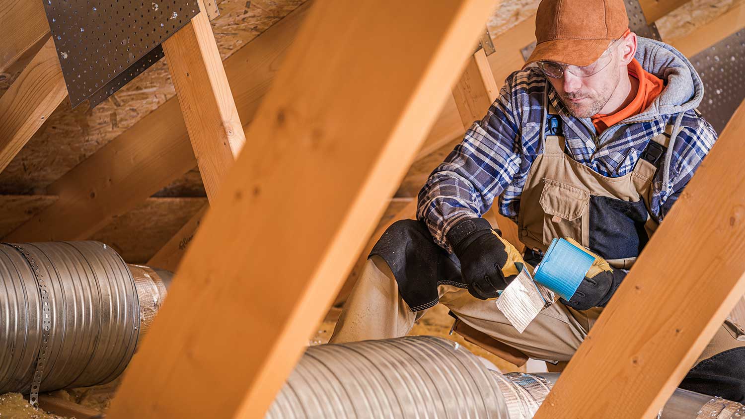 Worker installing heating system 