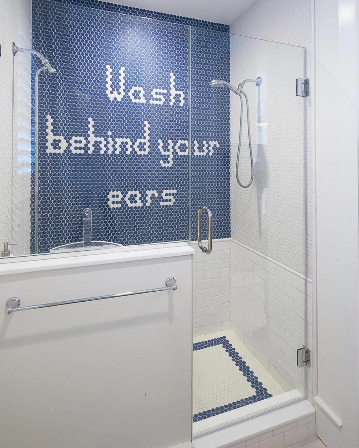 A kids bathroom with a creative shower