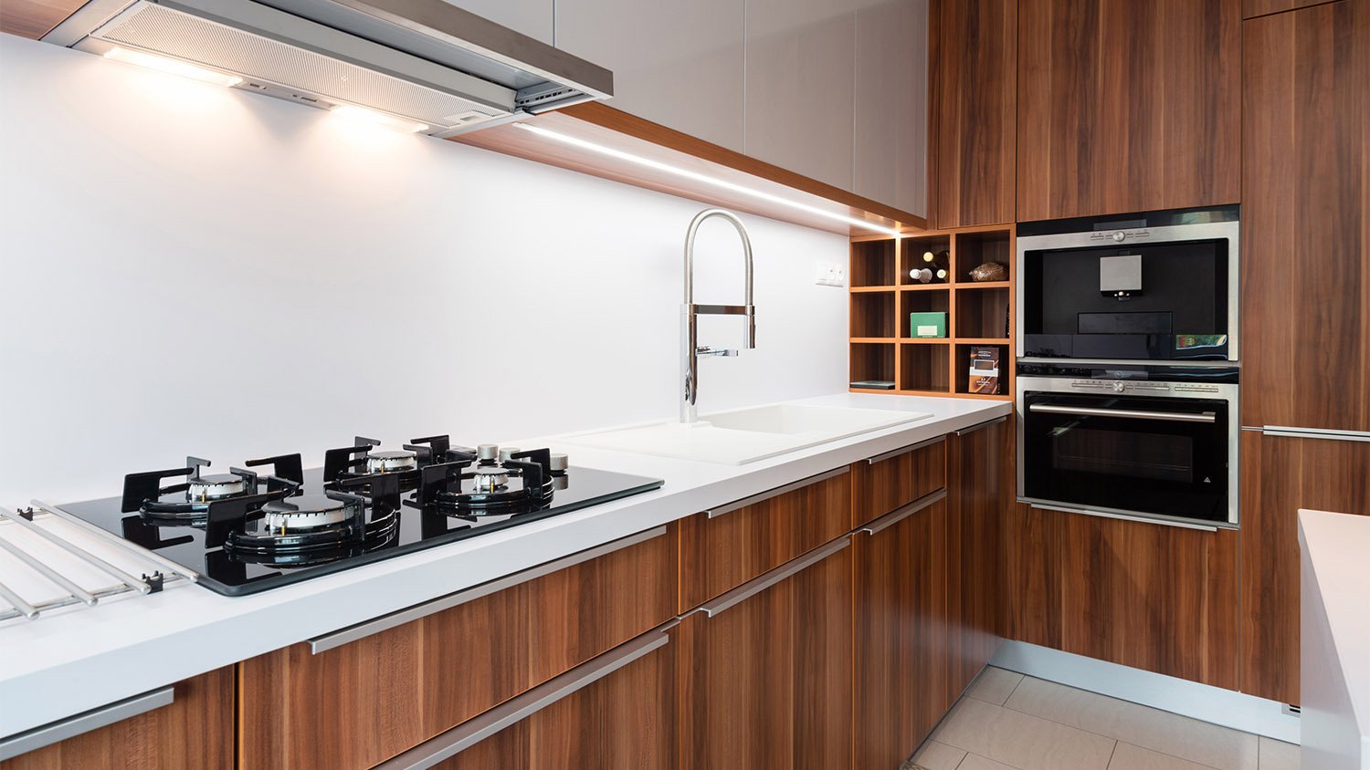 contemporary brown kitchen with cabinet lights