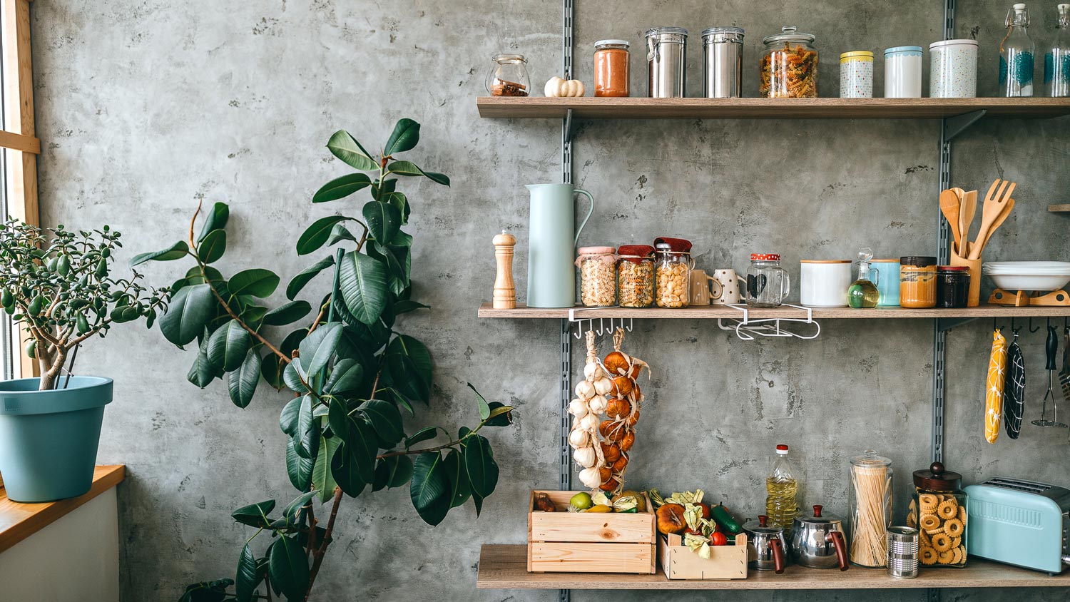 Kitchen jars with groceries stored on kitchen shelves