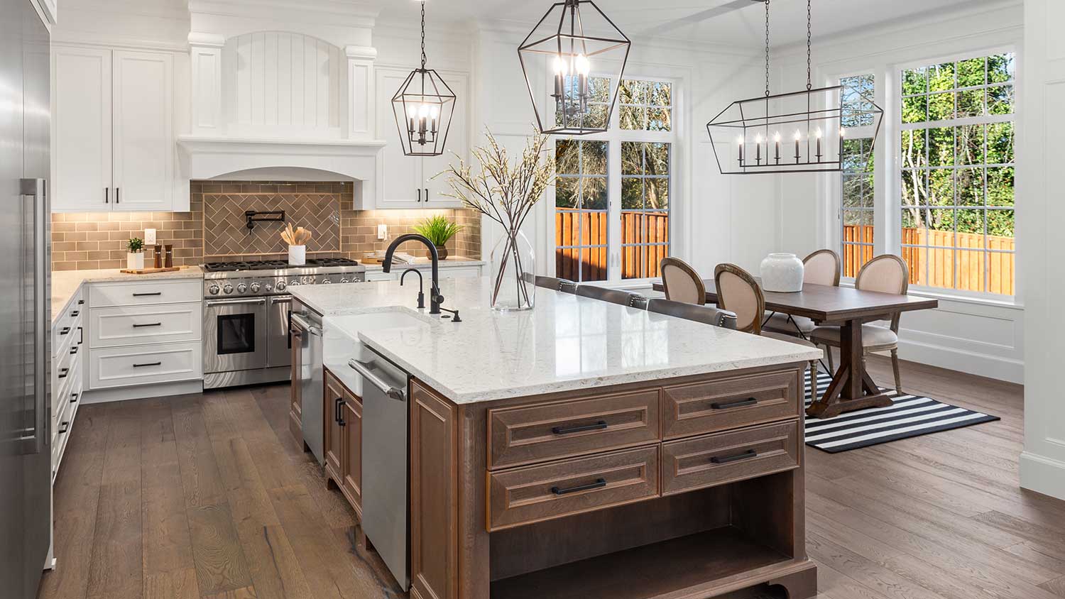 Kitchen with pendant lights and marble countertop