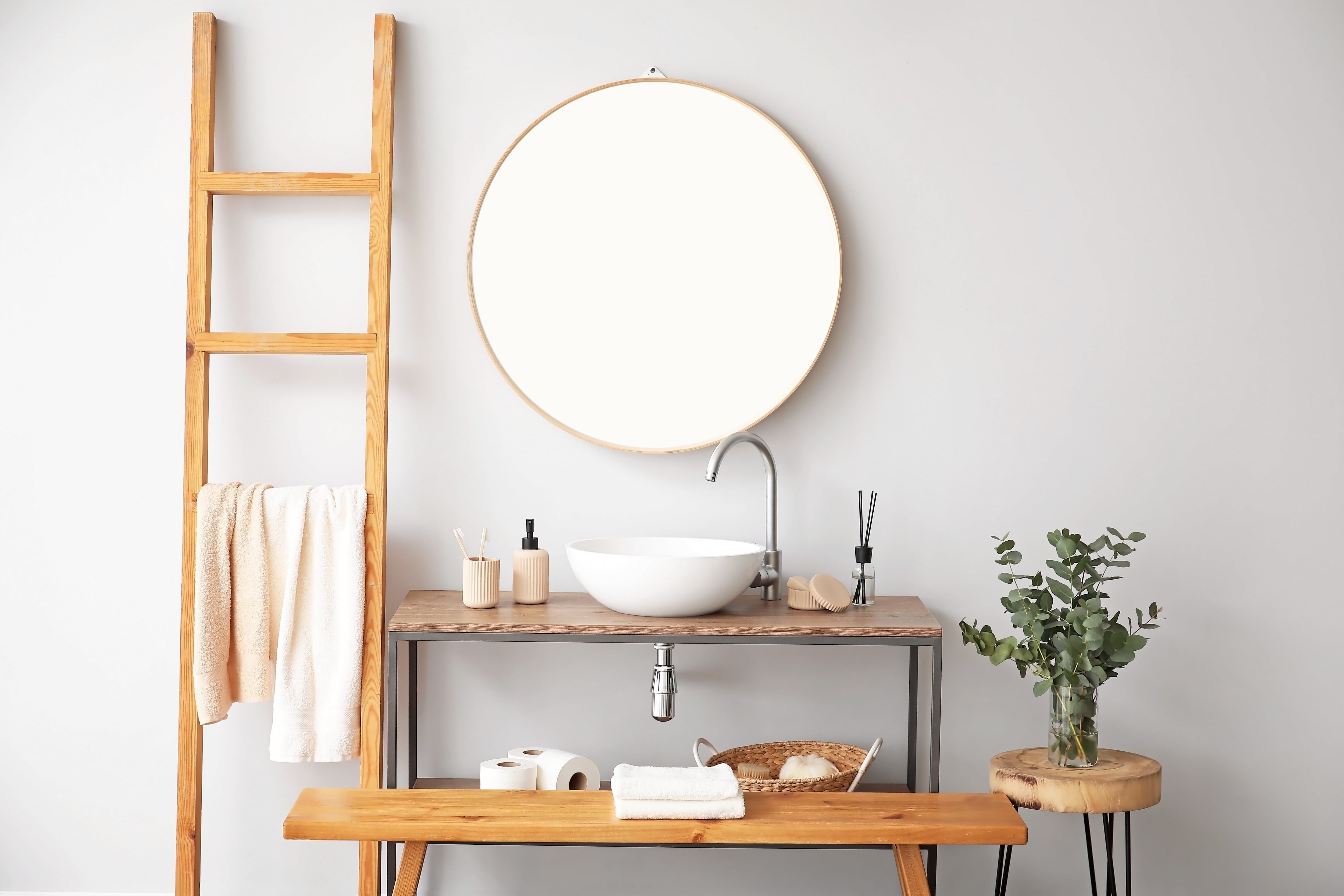 Towels hanging on ladder in bathroom