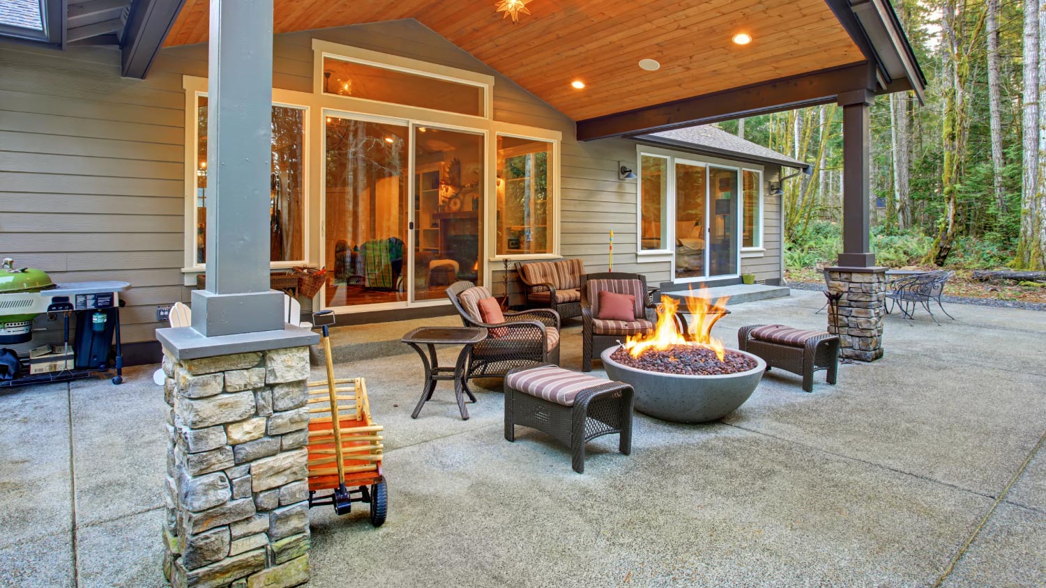 A large backyard with a firepit