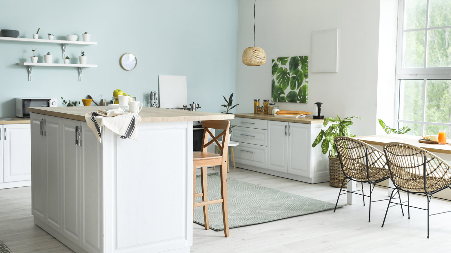 A large bright kitchen with a small kitchen island