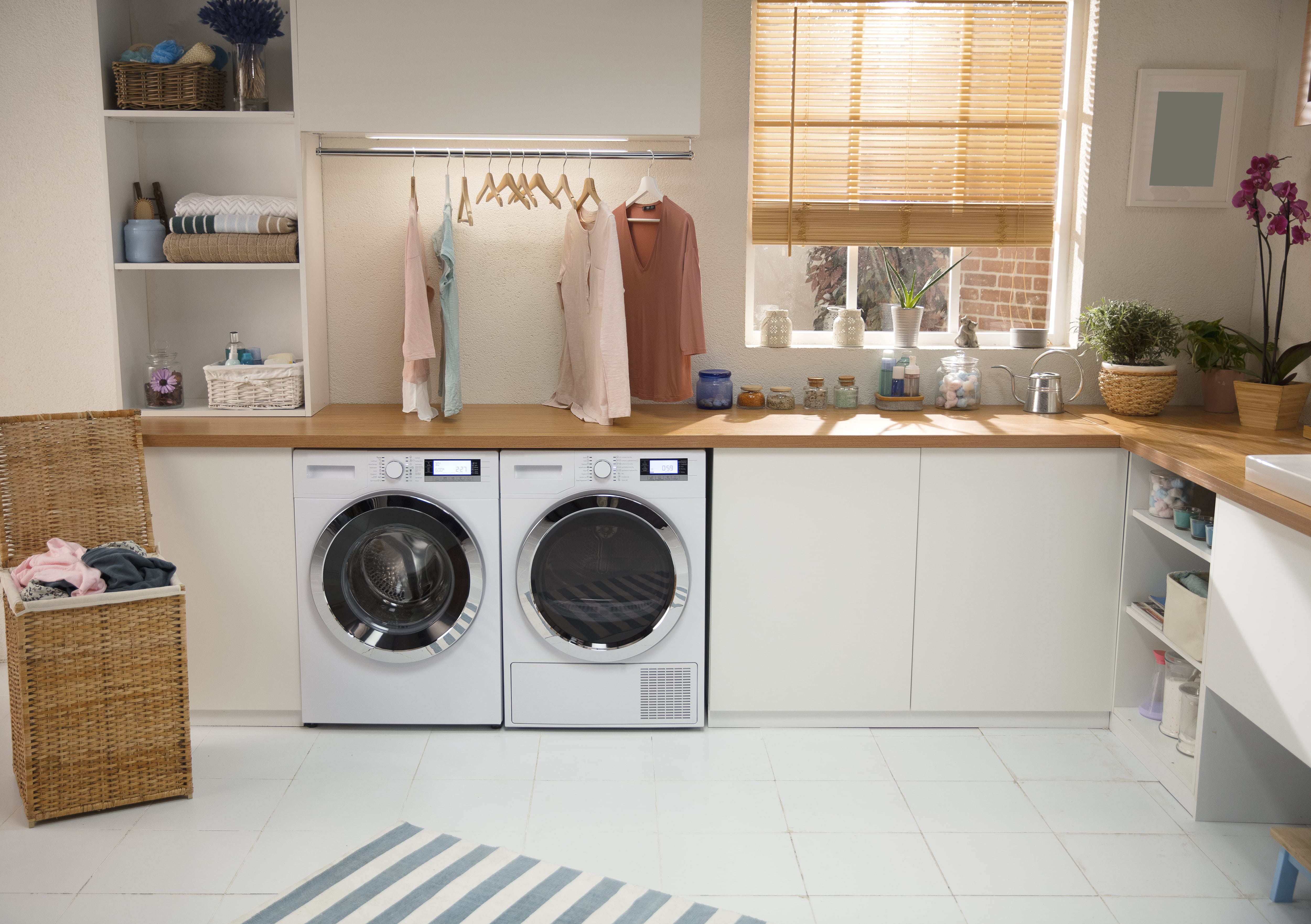 Large laundry room with hanging clothes rack