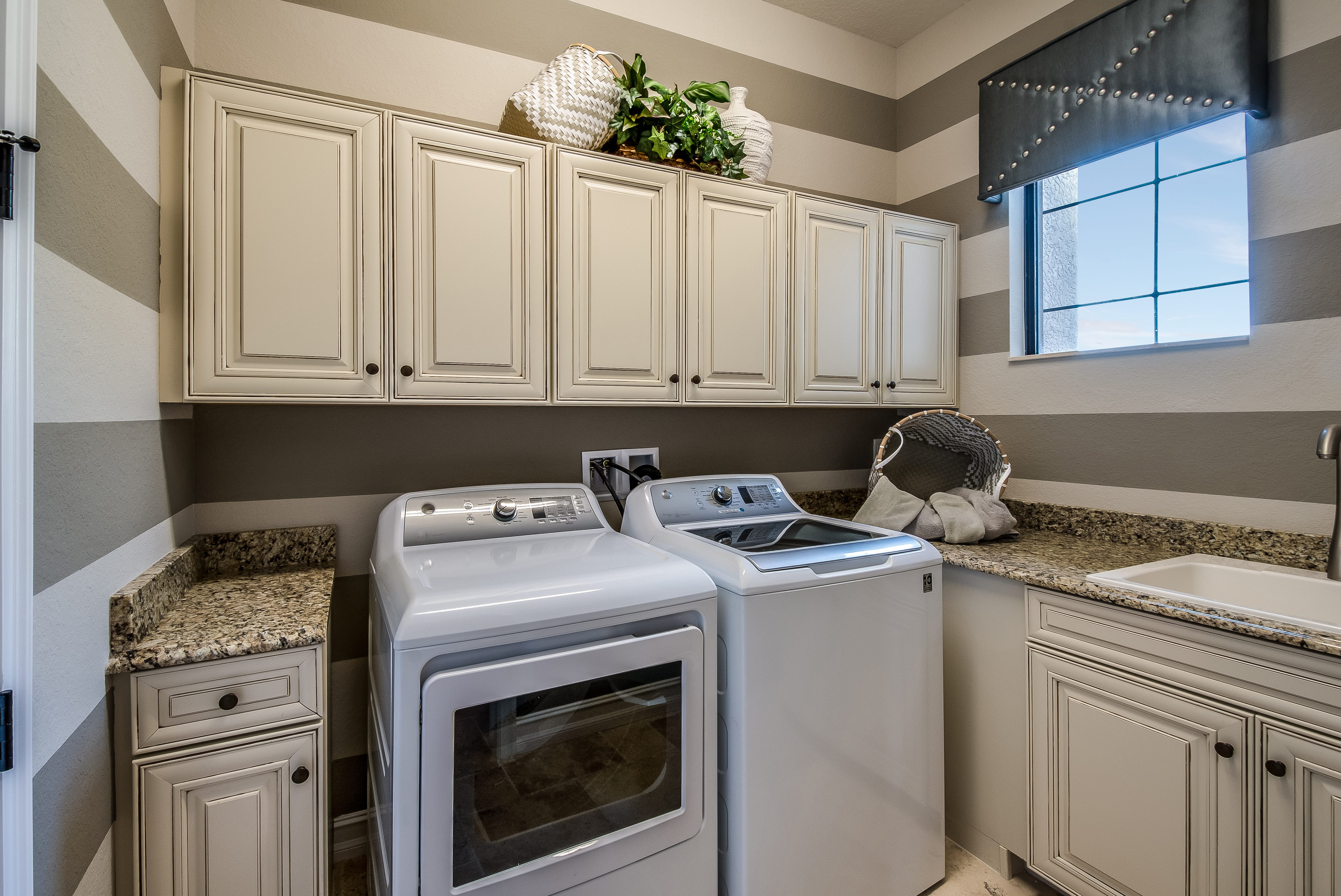 Gray and white striped laundry room