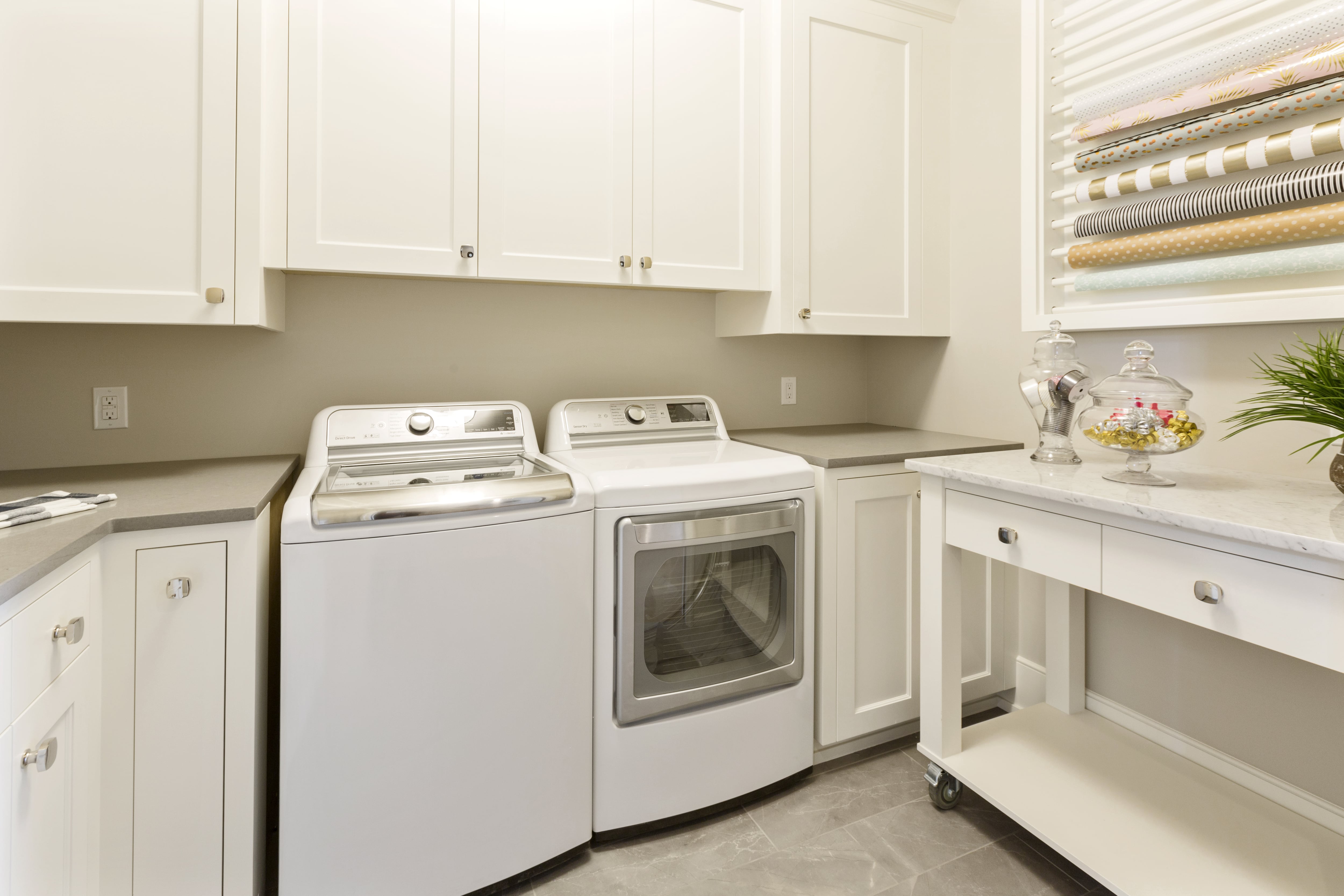 Laundry room with marble kitchen island