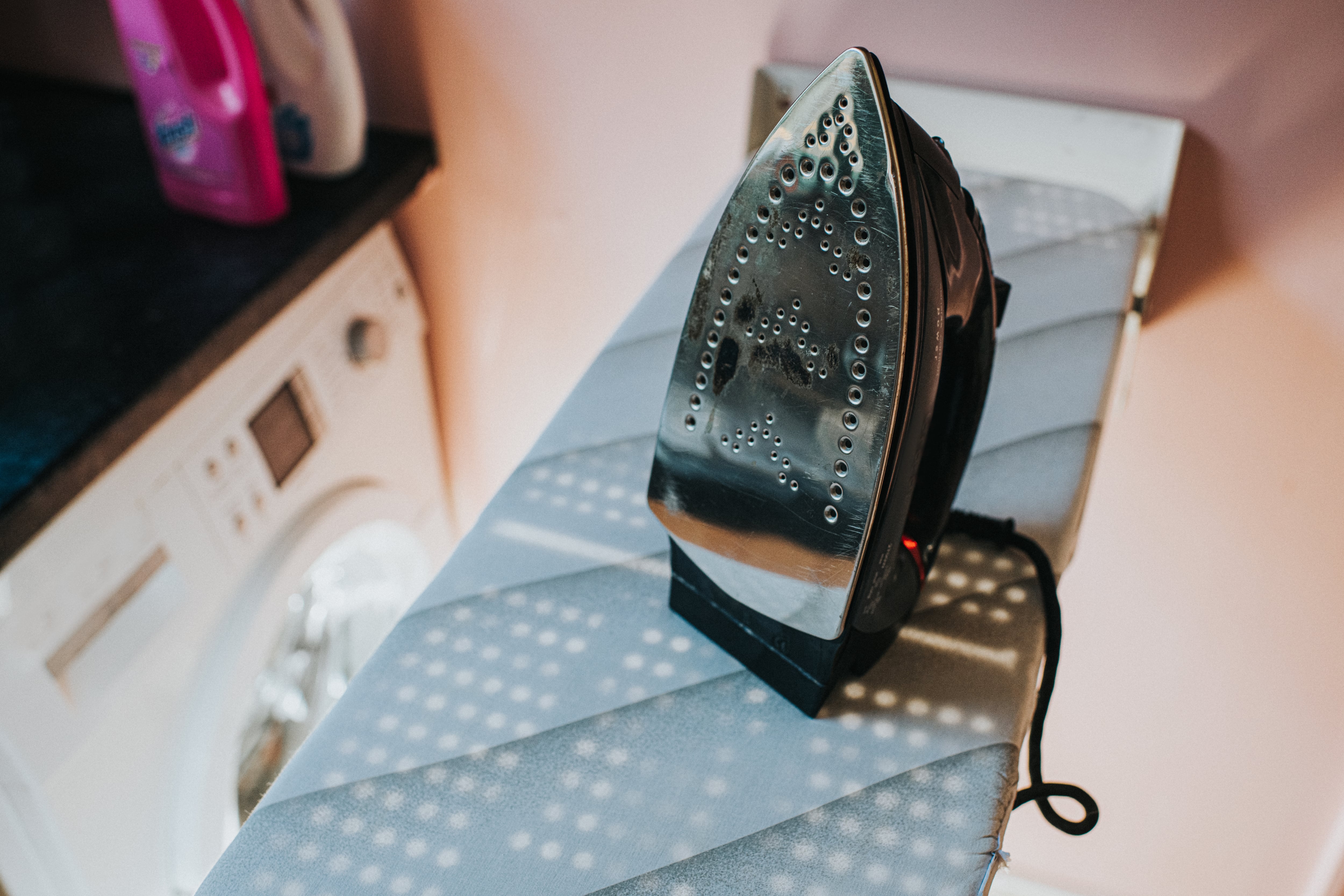 Pull-down ironing board in a laundry room