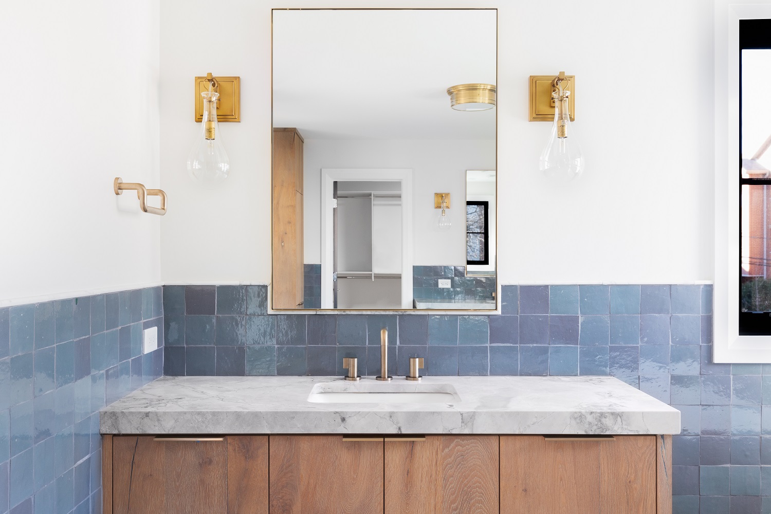 A cabinet-style vanity with a granite countertop