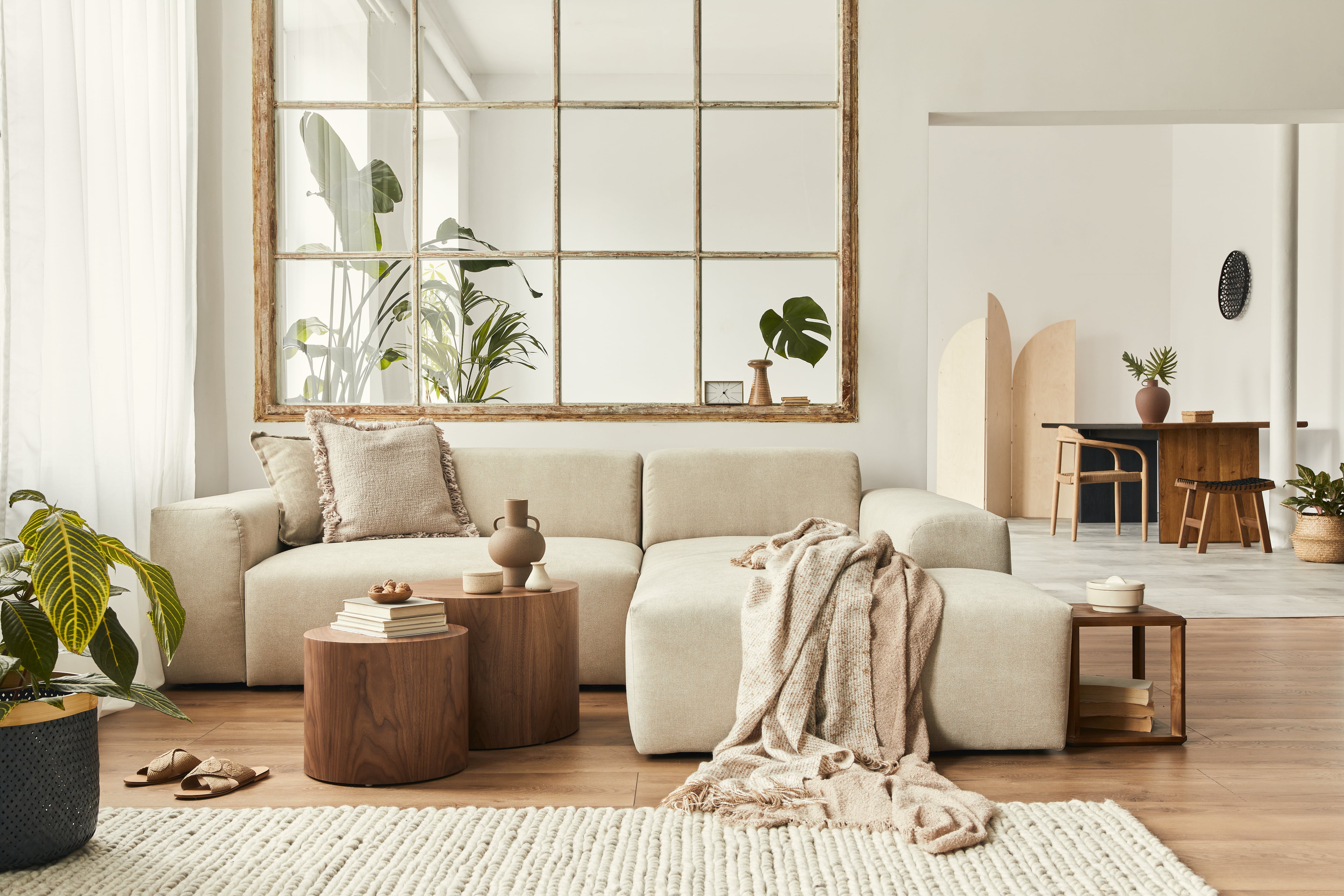 Living room with tan sofa and brown accents