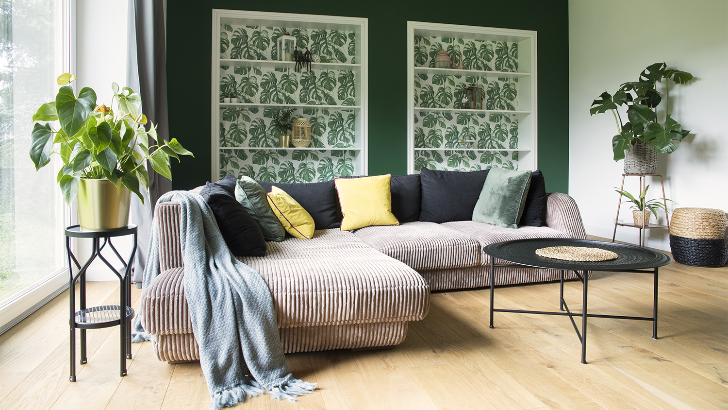 bright living room with green wall