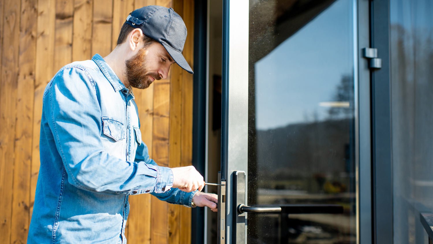  A locksmith repairing a door lock