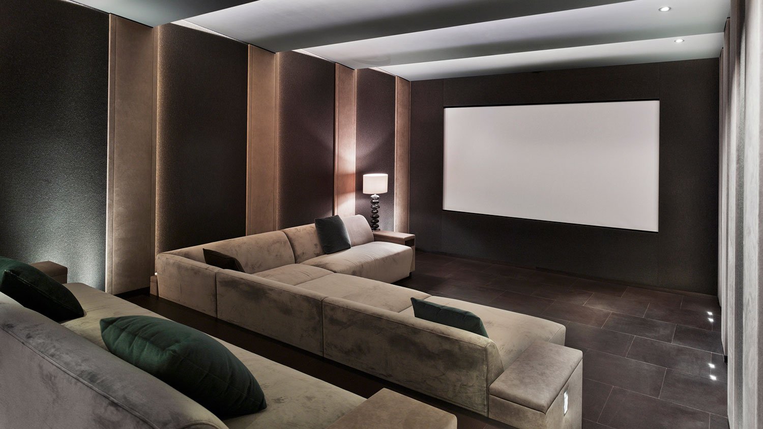 Interior of a home theater with suede couches