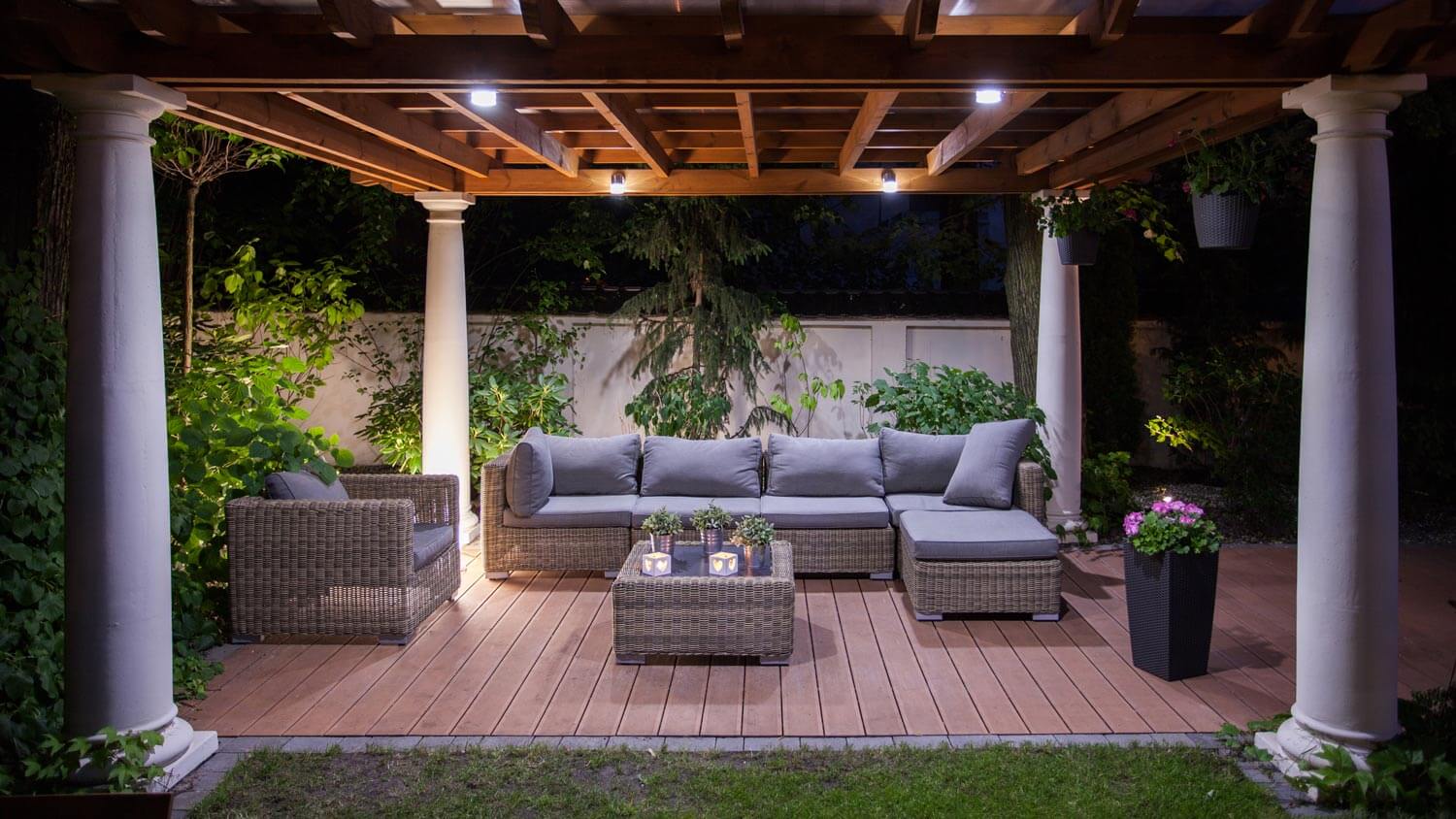A luxury patio with a wooden pergola
