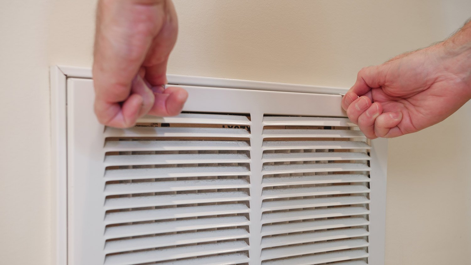 A man ready to clean an air duct