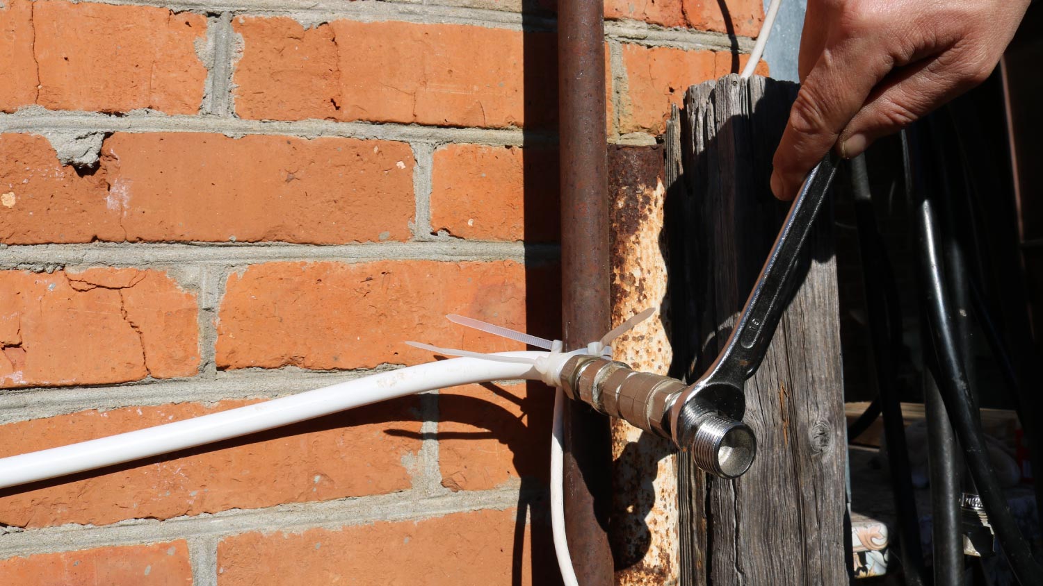 A man repairing an outlet water pipe