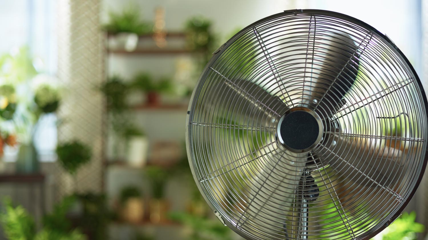 A modern metallic floor stand electric fan
