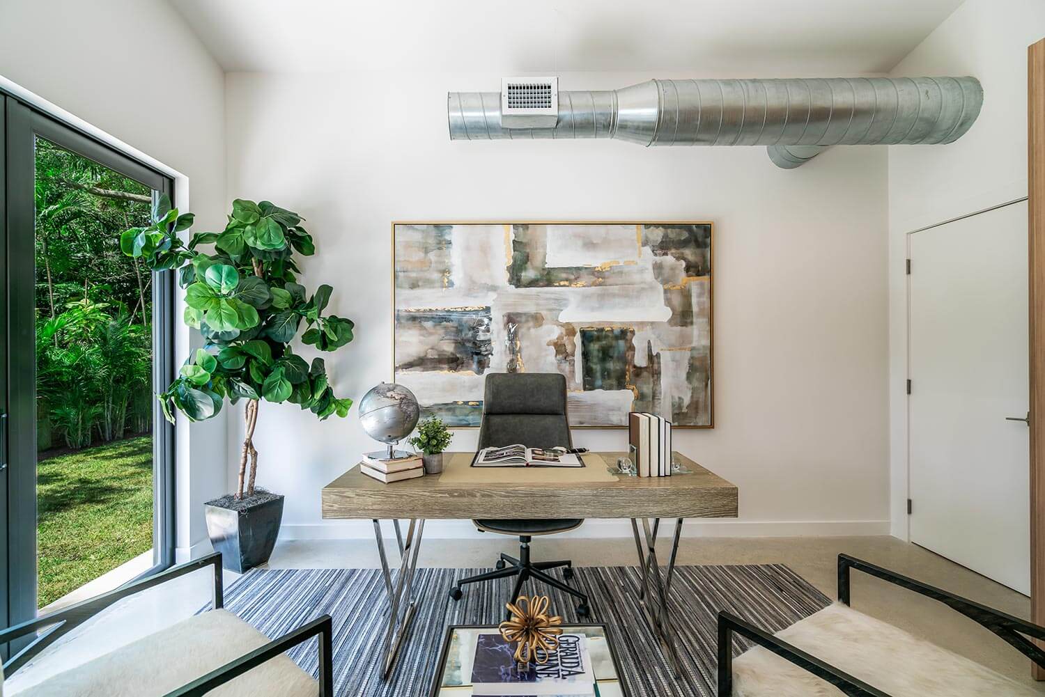 A modern bio office with a large houseplant on the corner