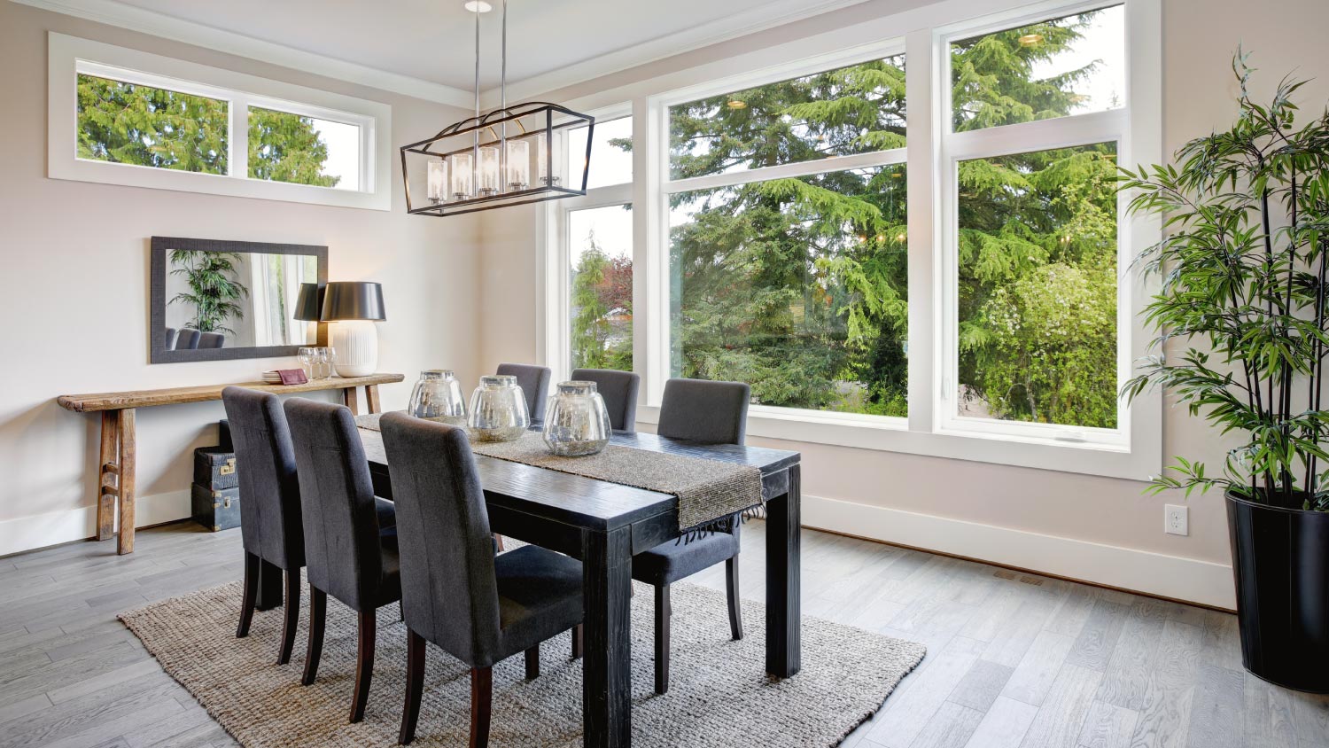 Luxurious modern dining room boasts a black dining table