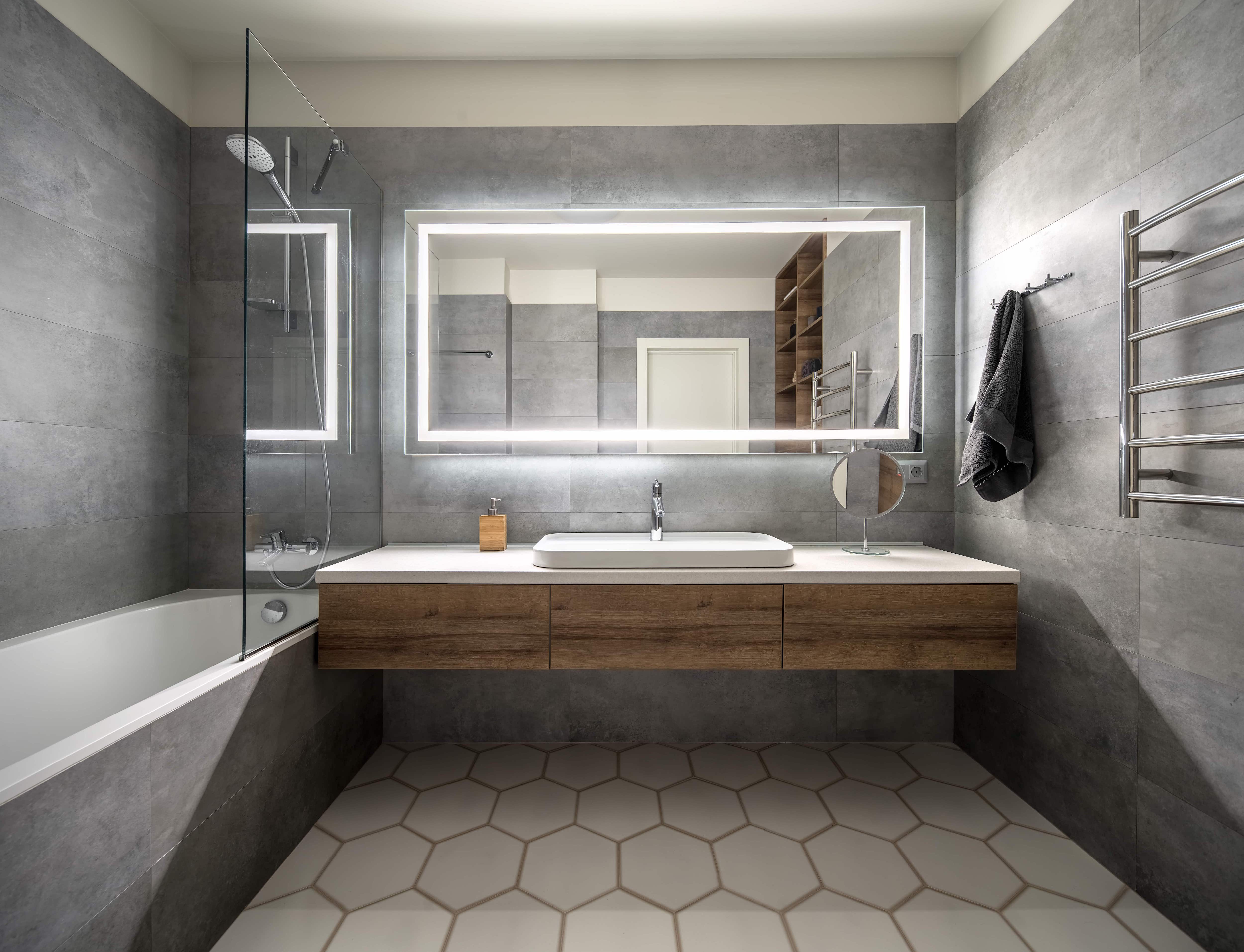 Modern bathroom with illuminated mirror