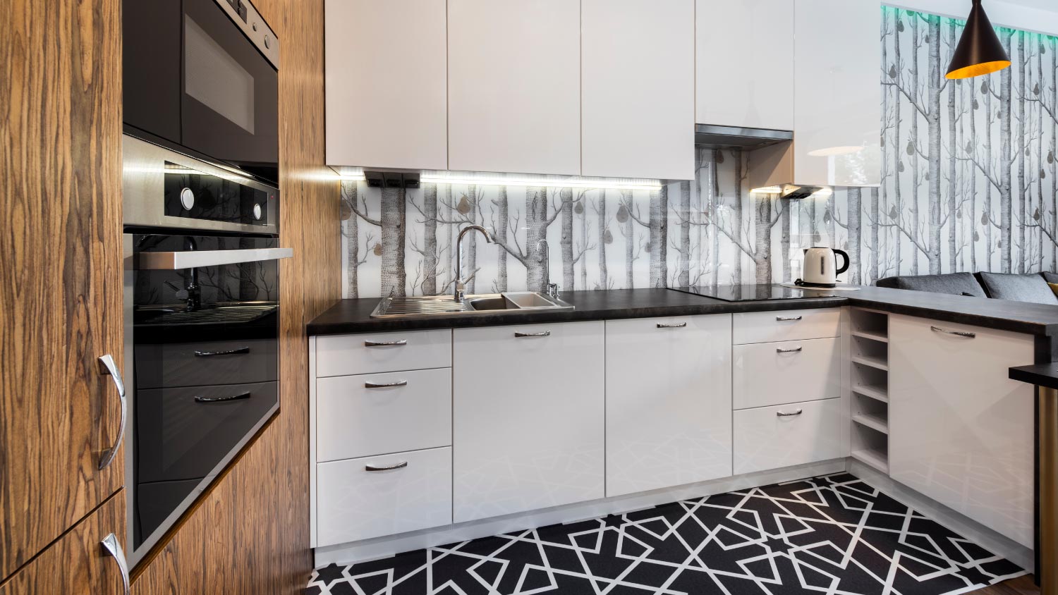 A modern kitchen with black countertops