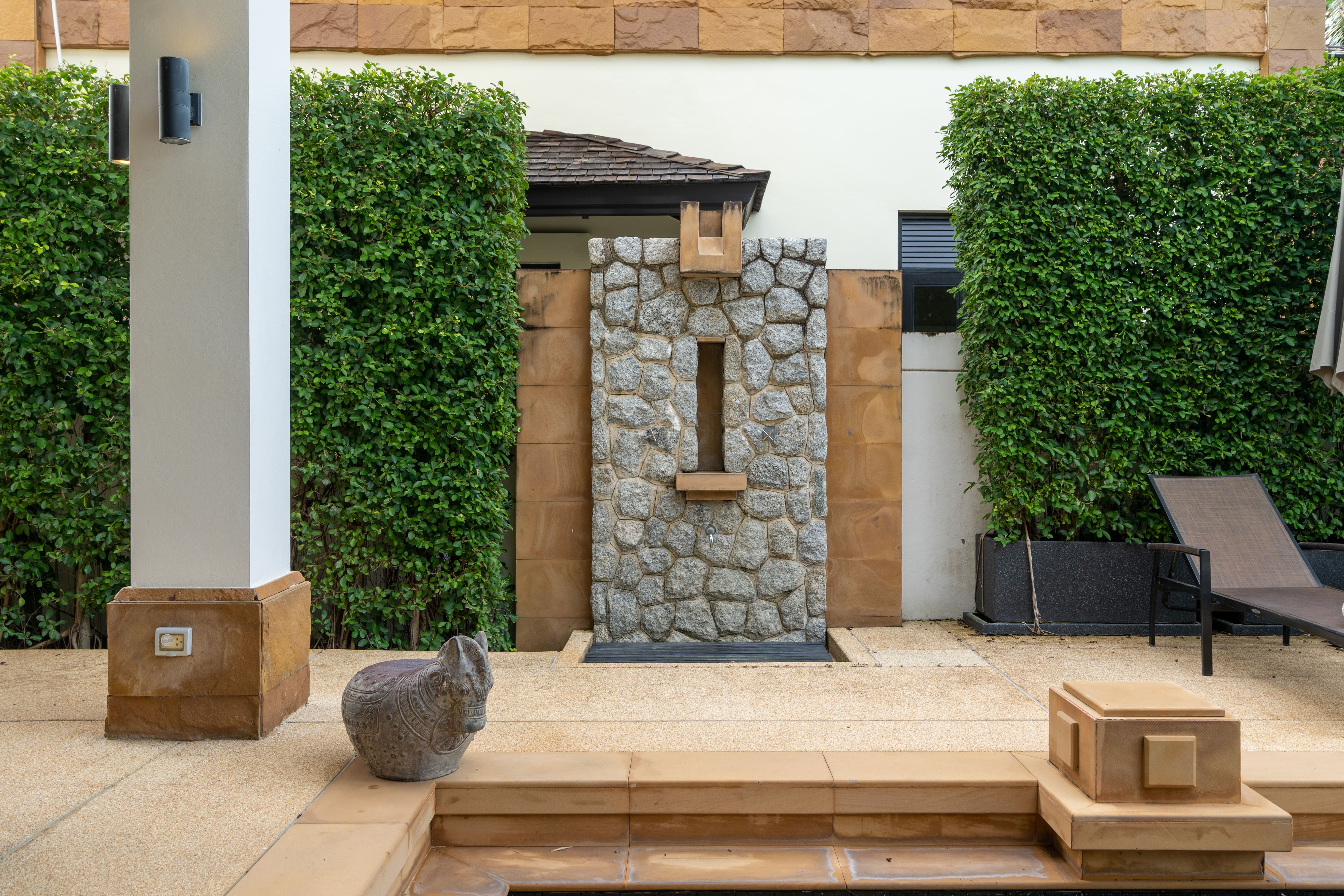 A modern luxury terrace with an outdoor shower