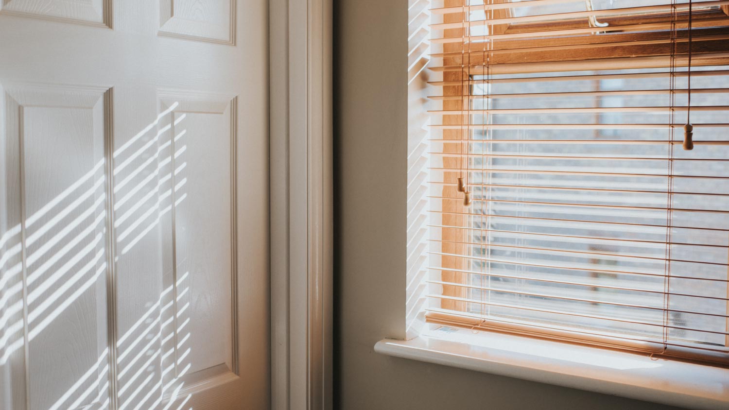 A natural wooden window with curtains