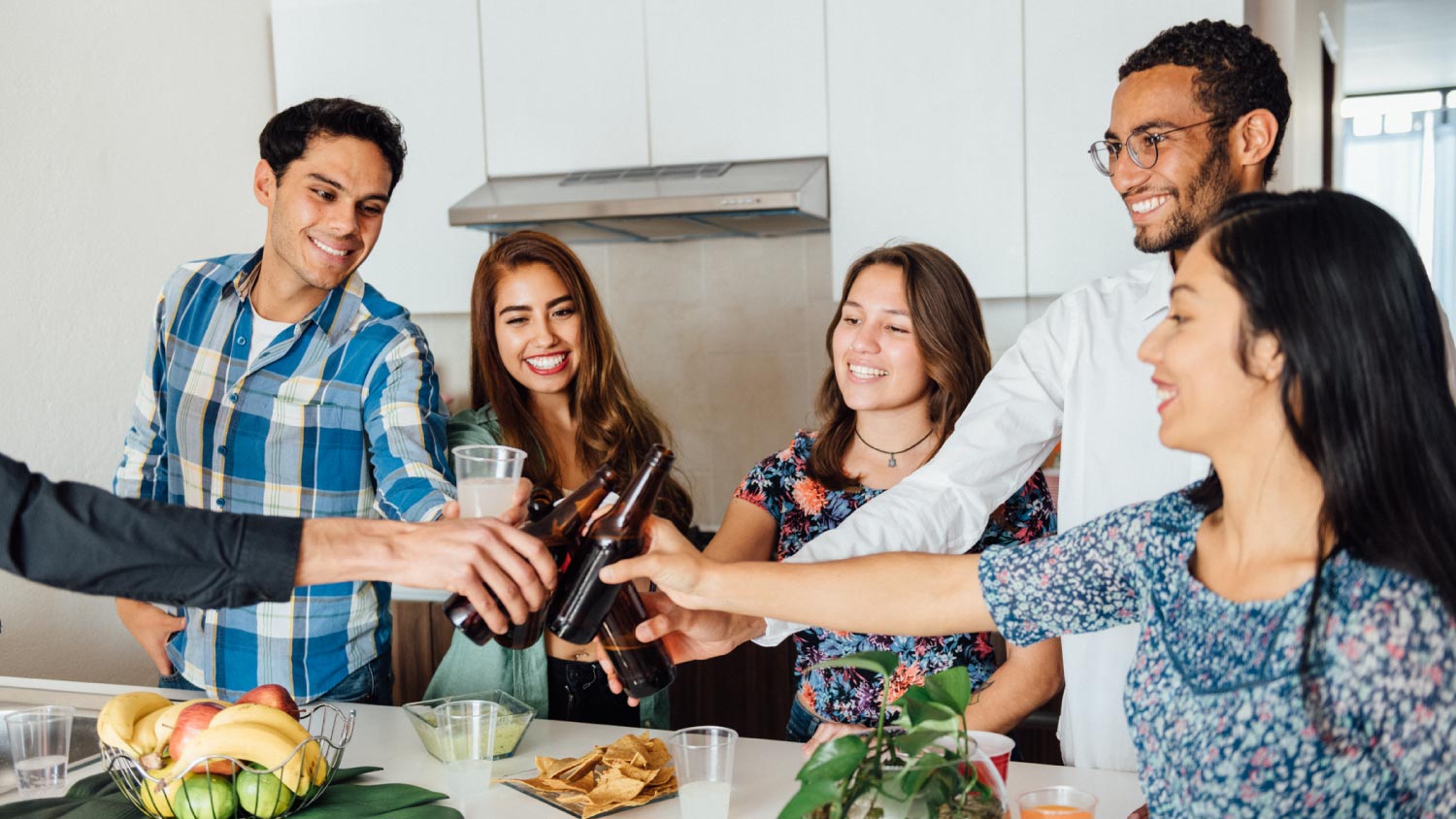 people drinking at a dinner party