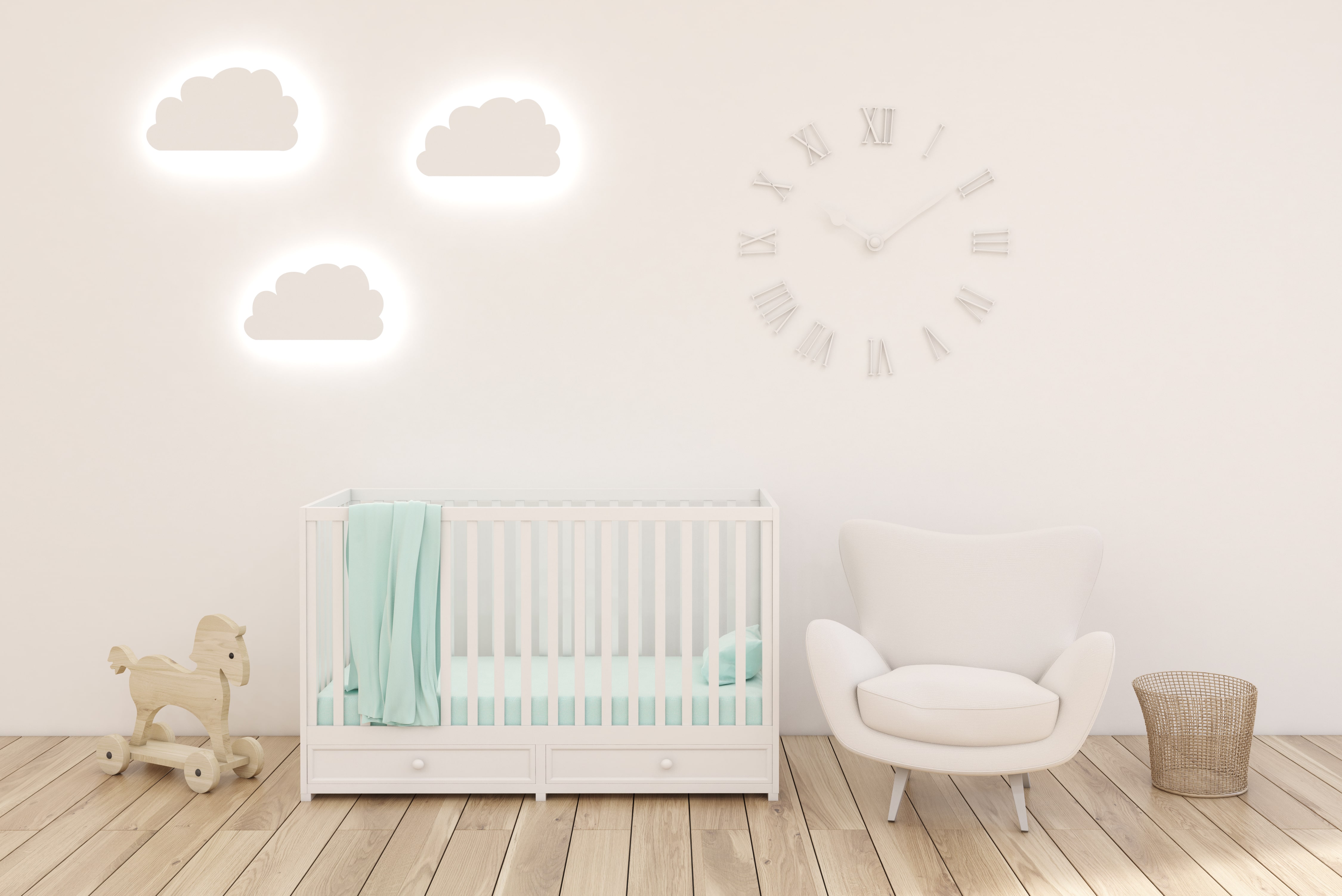 White nursery with cloud lighting decals on the wall