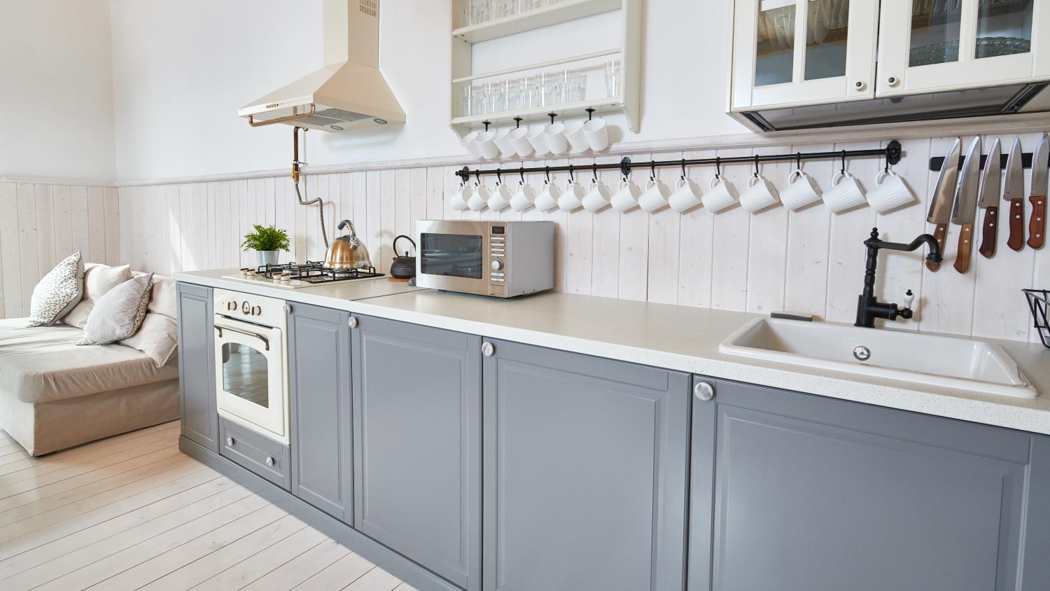 Open living room with grey kitchen