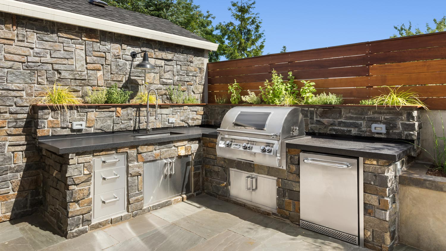 An outdoor barbecue and kitchen