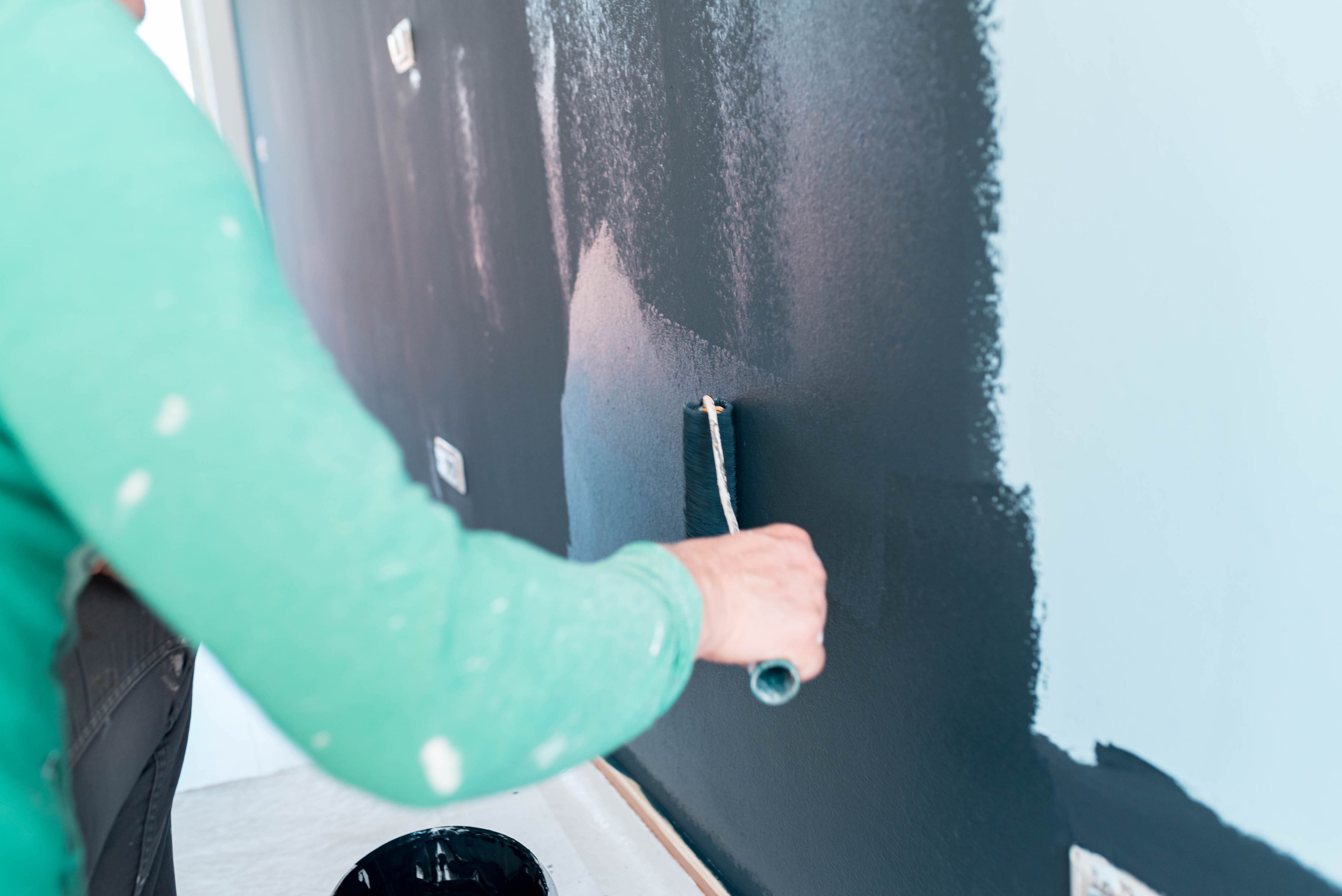 Painting wall black with a paint roller