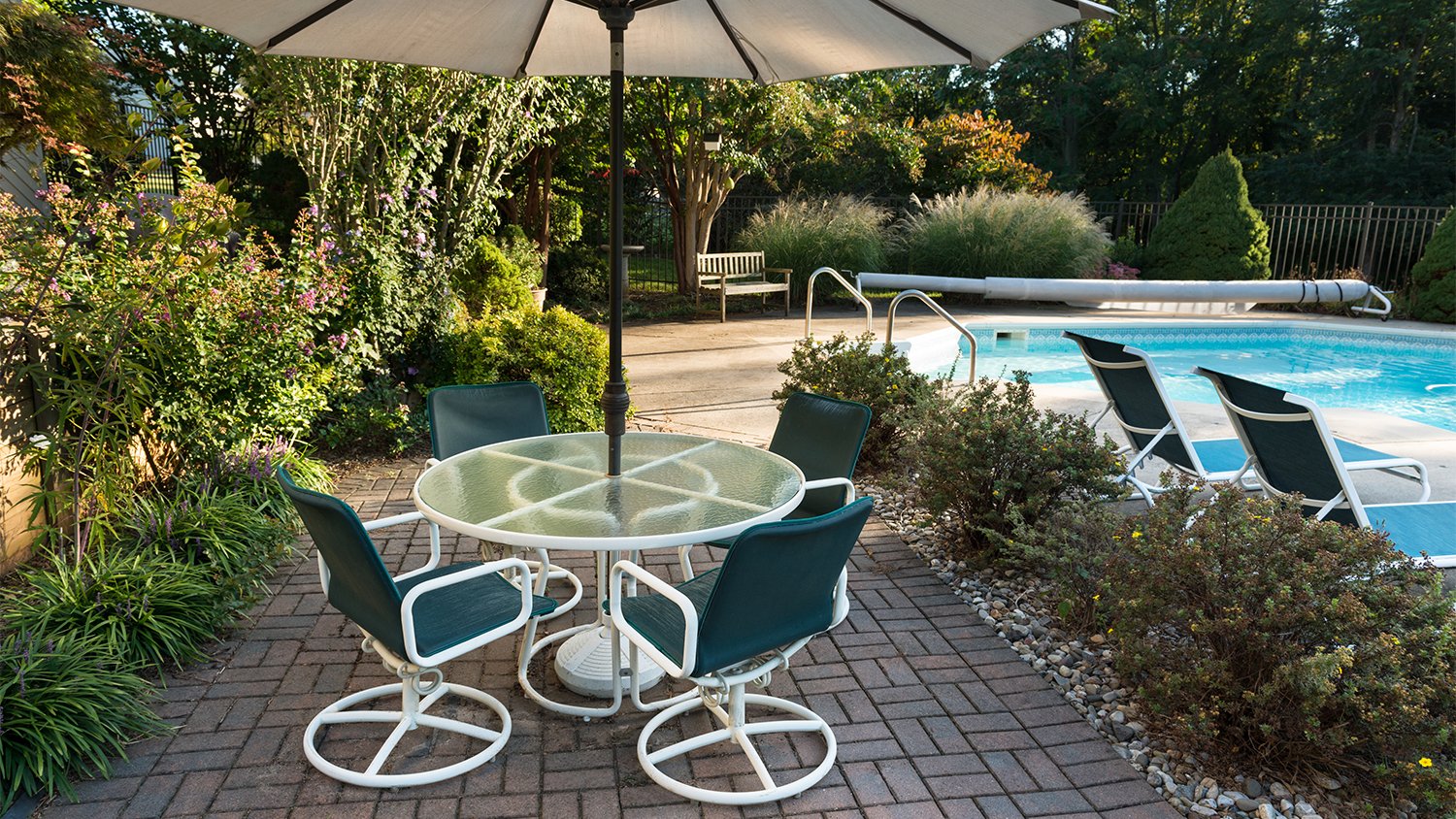 patio with pooland brick basket weave paver