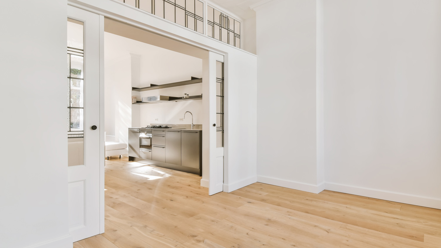 A pocket door leading to the kitchen