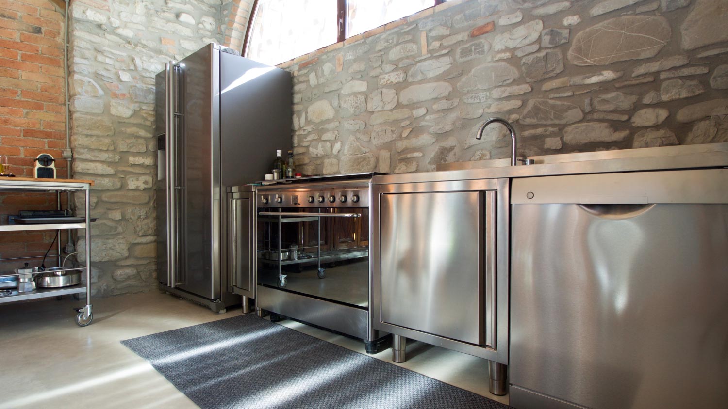 A professional kitchen in rustic interior