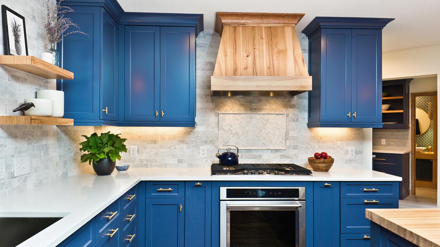 A kitchen with repainted blue cabinets