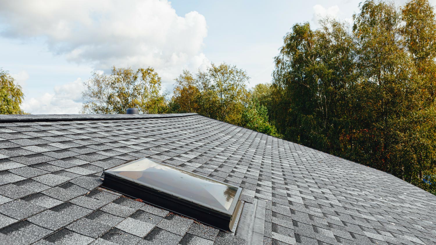 A roof window on shingles flat